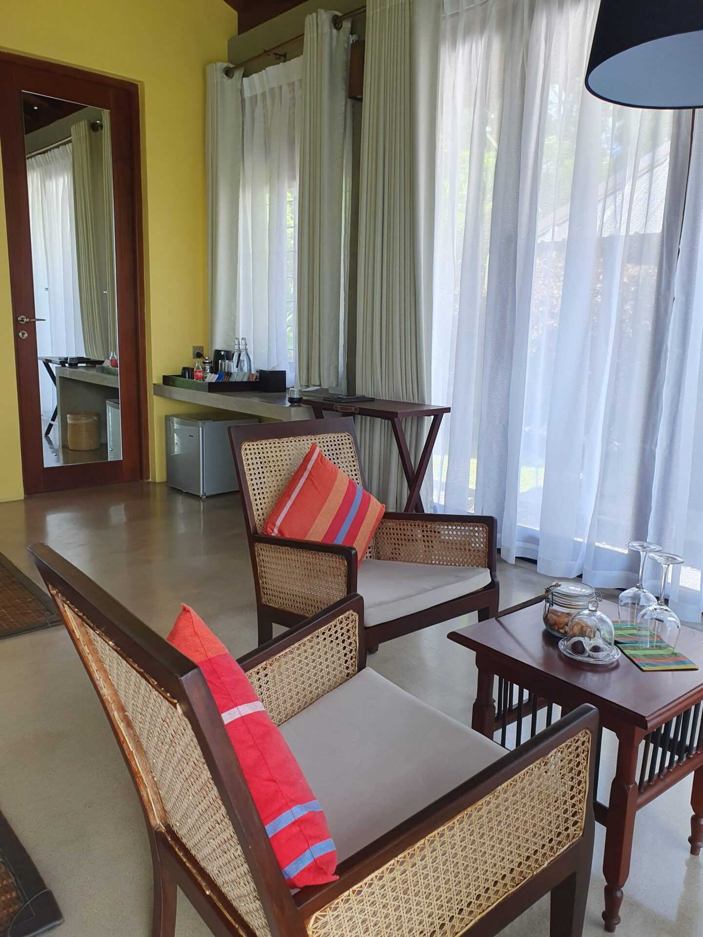 Colourful and inviting seating area inside a private standalone villa at Aarunya